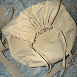 UNIQLO Cream Drawstring Crossbody